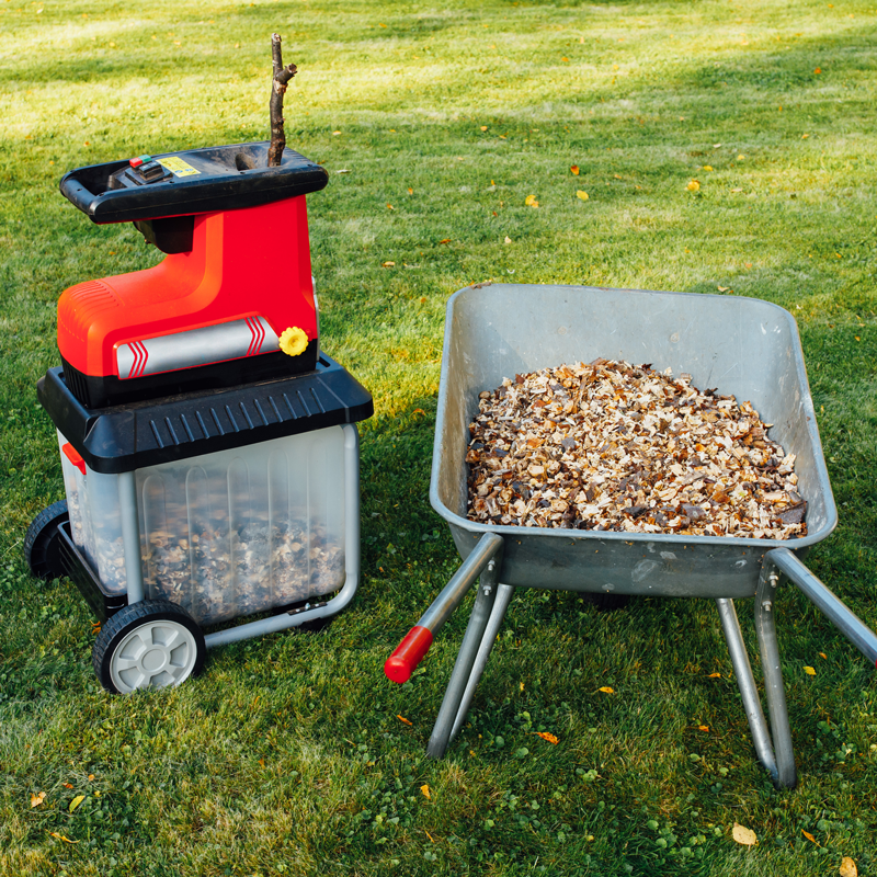 Wood chips made by an electric garden shredder with integrated collection basket